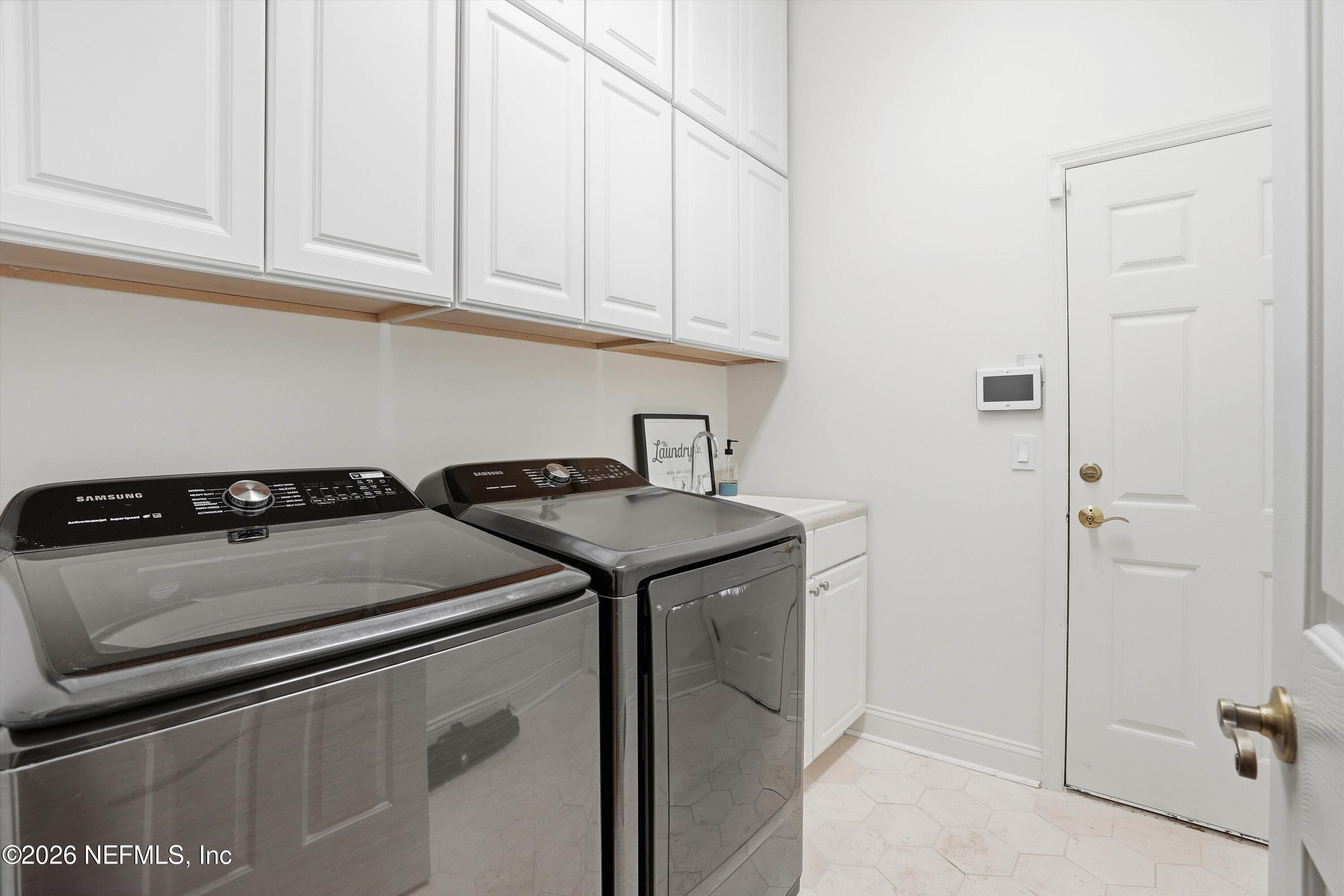 628 Pelham Road St. Augustine, FL 32092 - Photo 31 of 56 a utility room with dryer and washer