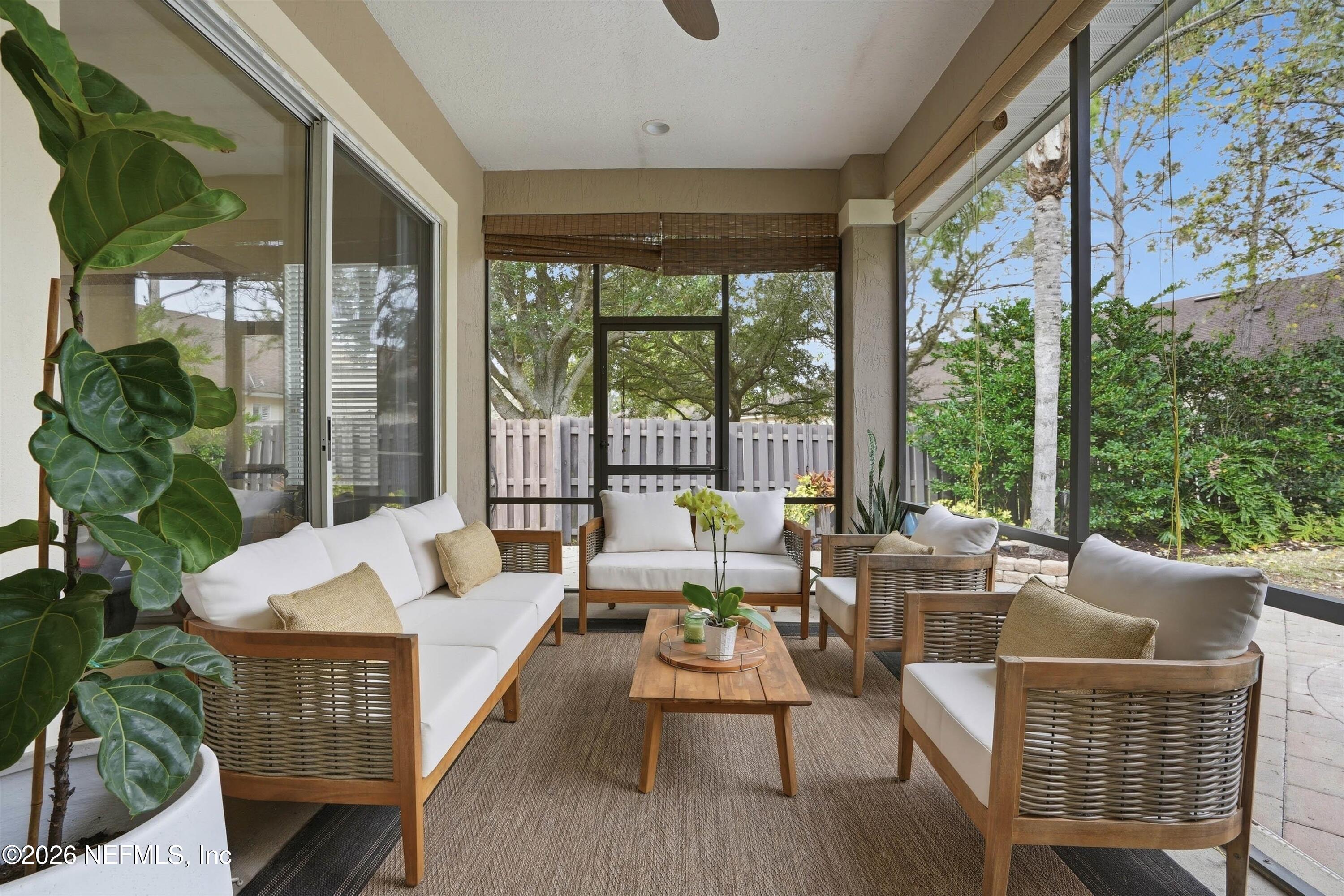 628 Pelham Road St. Augustine, FL 32092 - Photo 33 of 56 a living room with furniture and a large window
