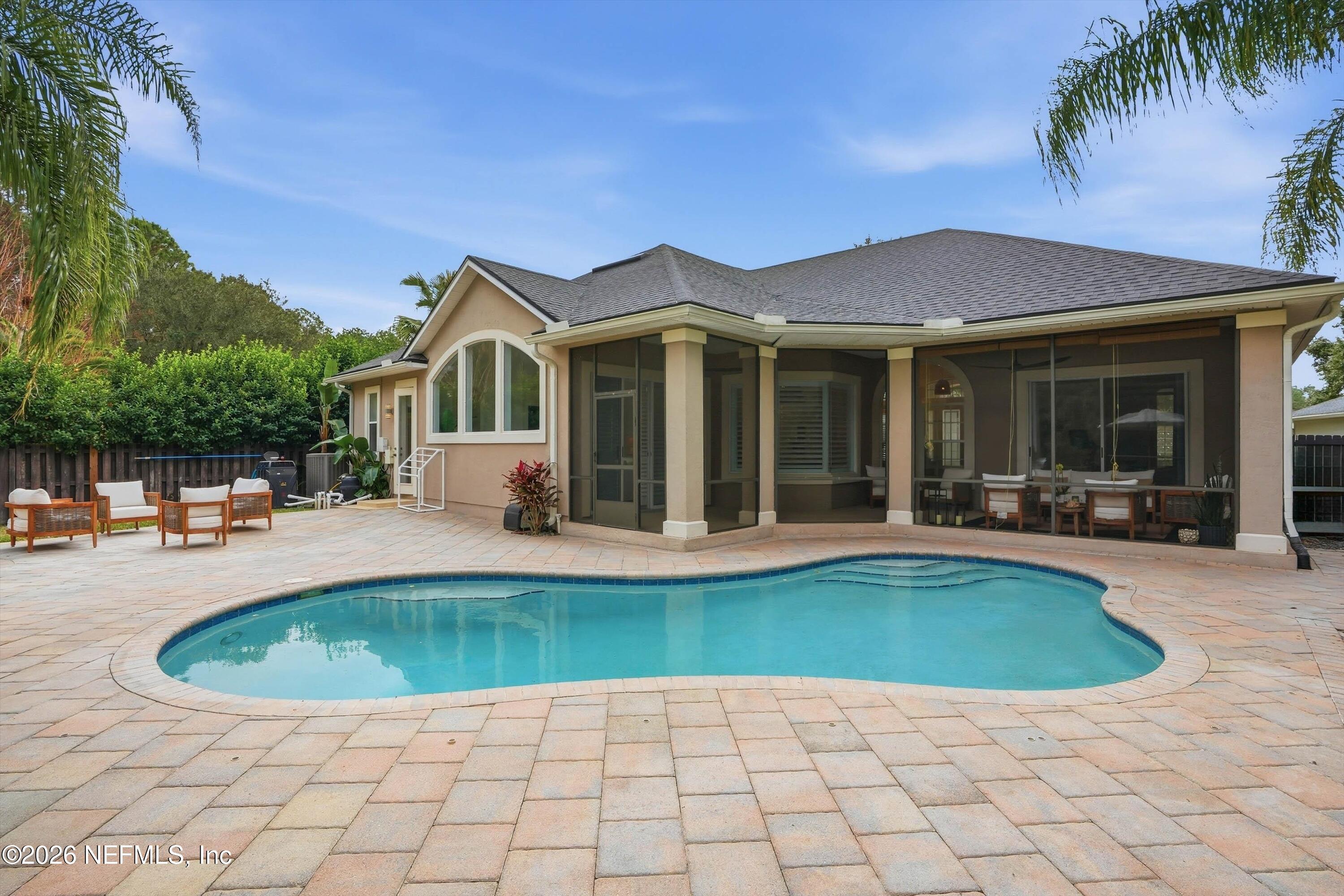628 Pelham Road St. Augustine, FL 32092 - Photo 37 of 56 a view of a house with swimming pool and sitting area