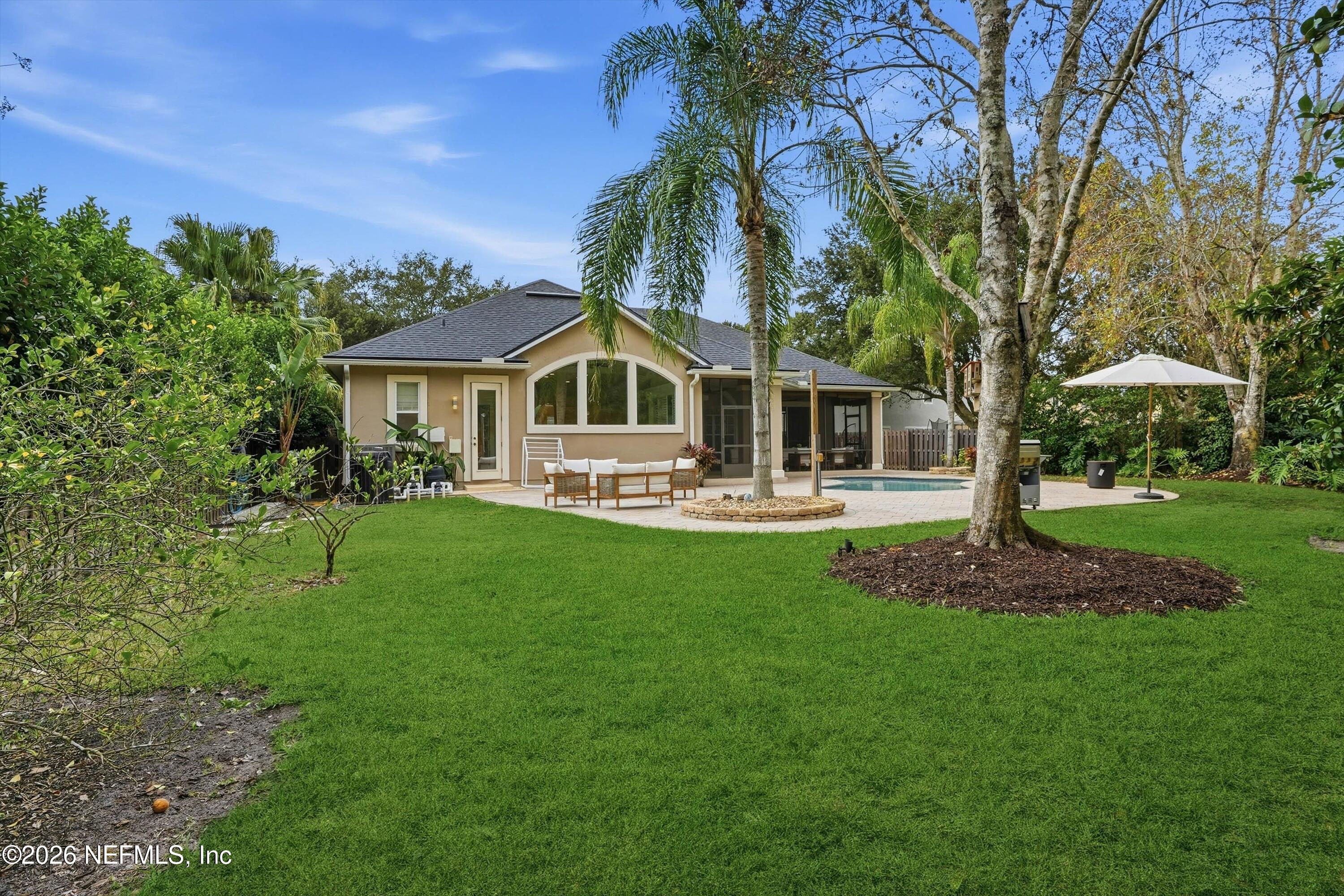 628 Pelham Road St. Augustine, FL 32092 - Photo 40 of 56 a front view of a house with a yard