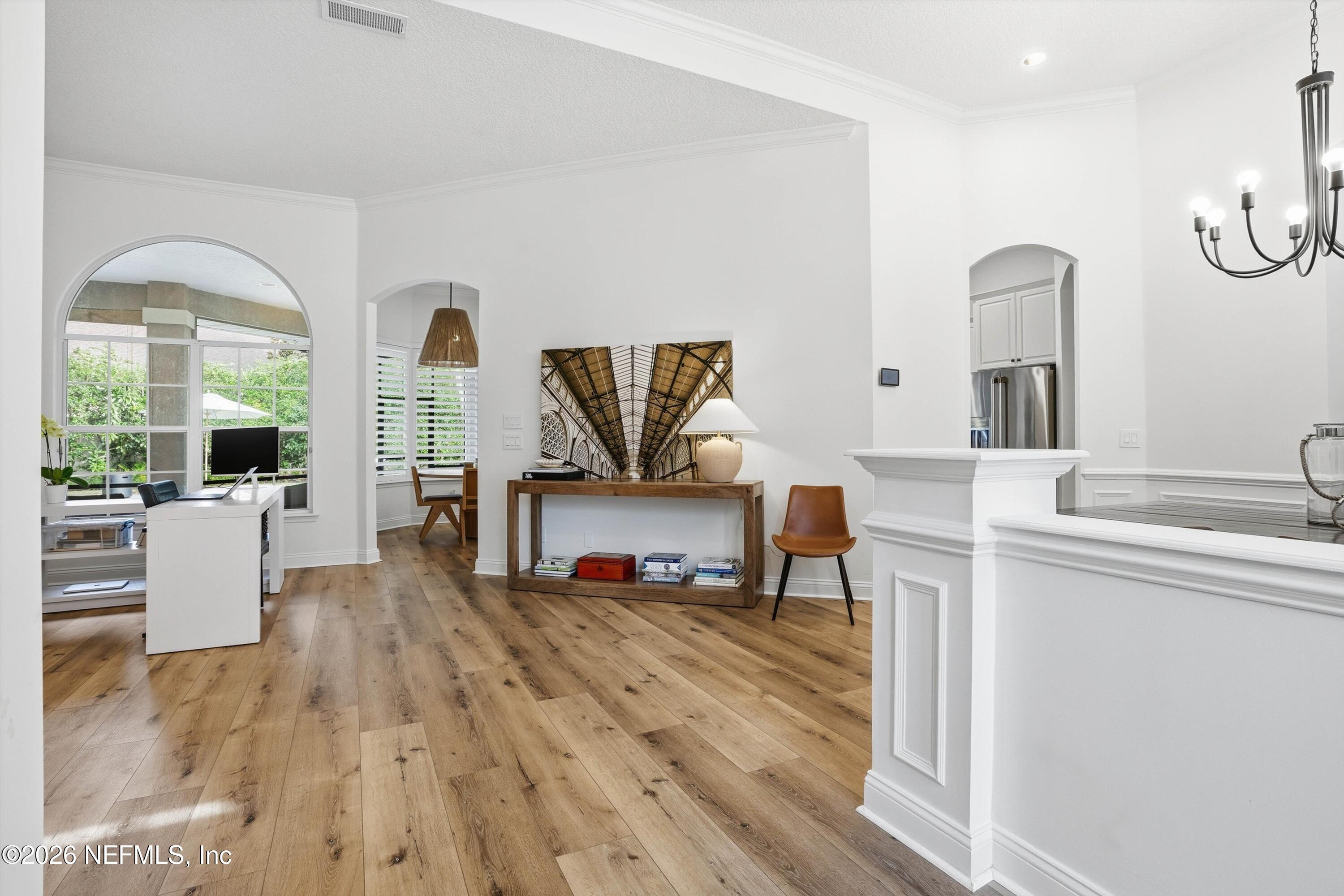 628 Pelham Road St. Augustine, FL 32092 - Photo 4 of 56 a living room with furniture and wooden floor