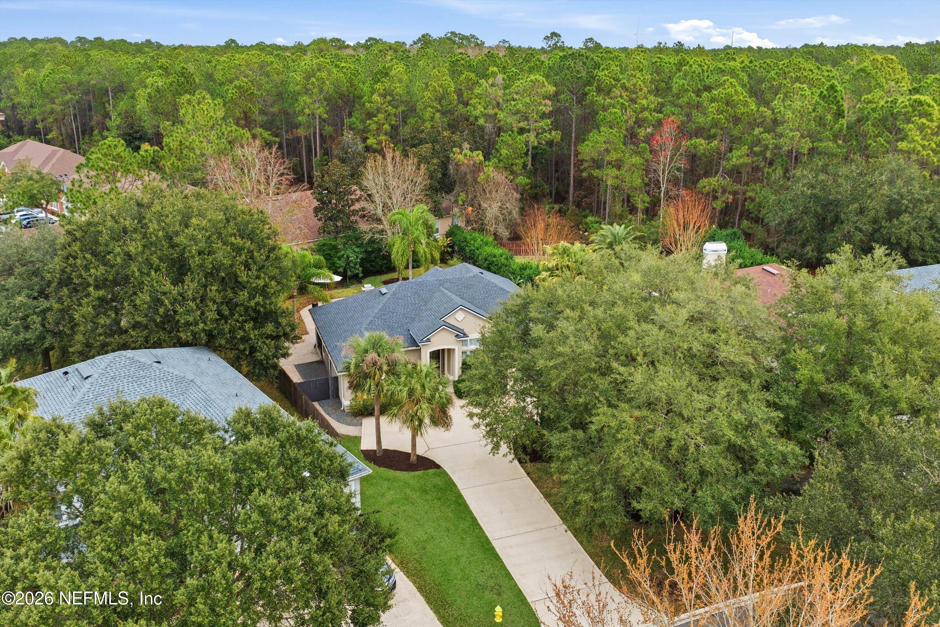 628 Pelham Road St. Augustine, FL 32092 - Photo 41 of 56 a view of a garden with a building in the background