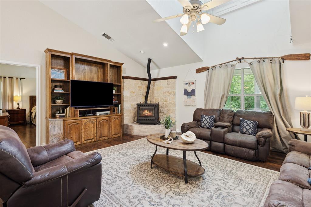 1000 Ballard Road Van Alstyne, TX 75495 - Photo 14 of 40 a living room with furniture a flat screen tv and a large window