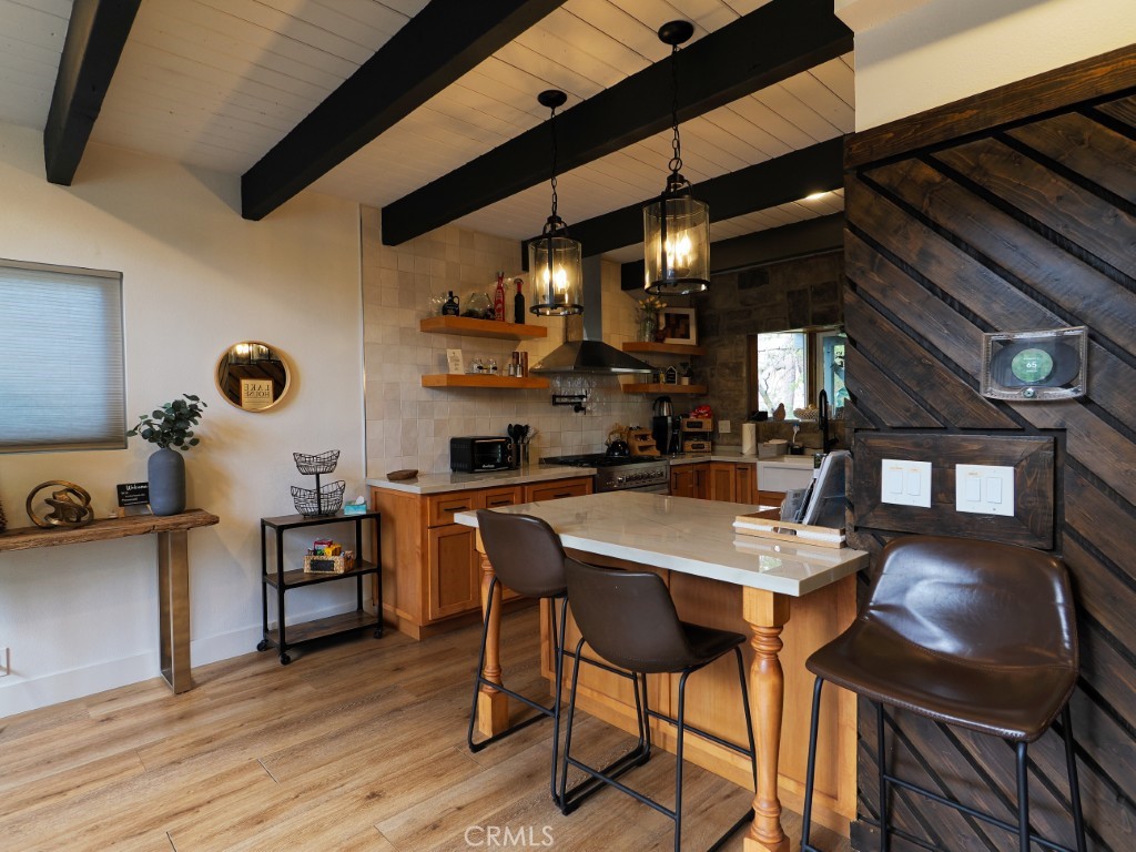28596 North Bay Road Lake Arrowhead, CA 92352 - Photo 24 of 69 a kitchen with a table and chairs in it