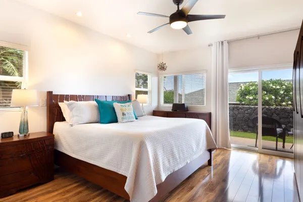 a bedroom with bed and large window