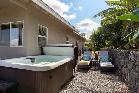 a view of a patio with table and chairs with wooden fence