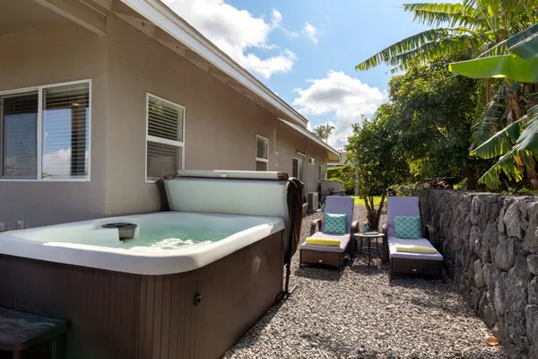 a view of a patio with table and chairs with wooden fence