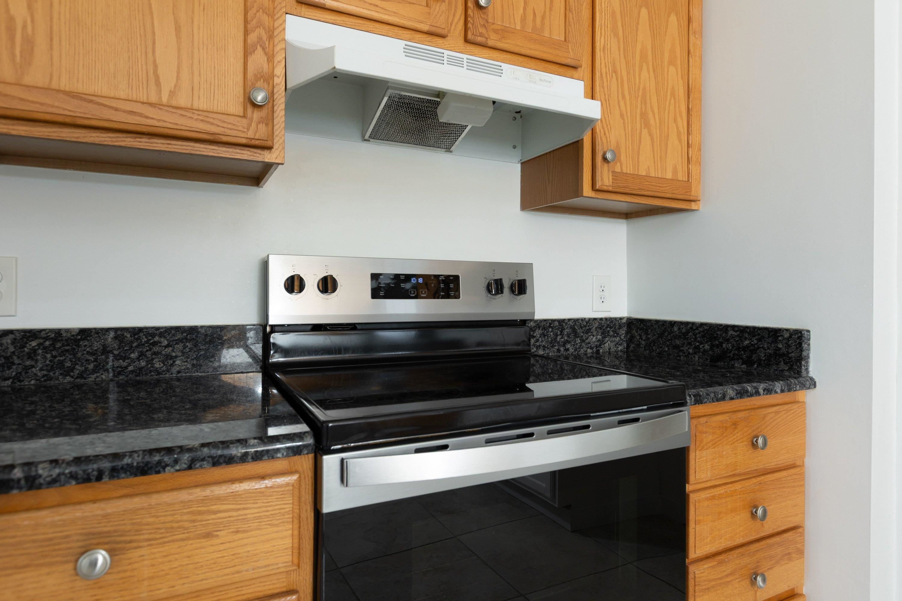 536 Three Leagues Road McGaheysville, VA 22840 - Photo 10 of 71 a stove top oven sitting inside of a kitchen