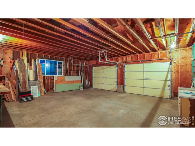 a room with lots of furniture and car