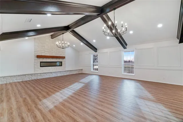a kitchen with stainless steel appliances a stove and cabinets