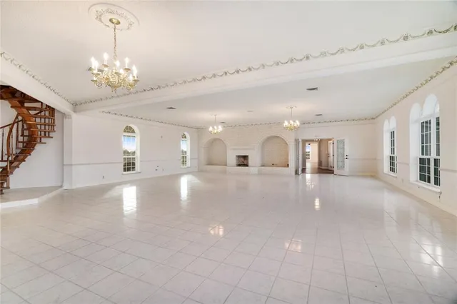 a view of a hallway with chandelier