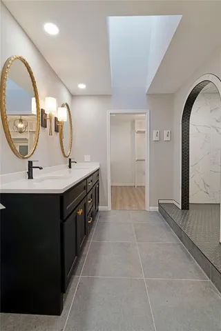 a bathroom with a bathtub and a sink