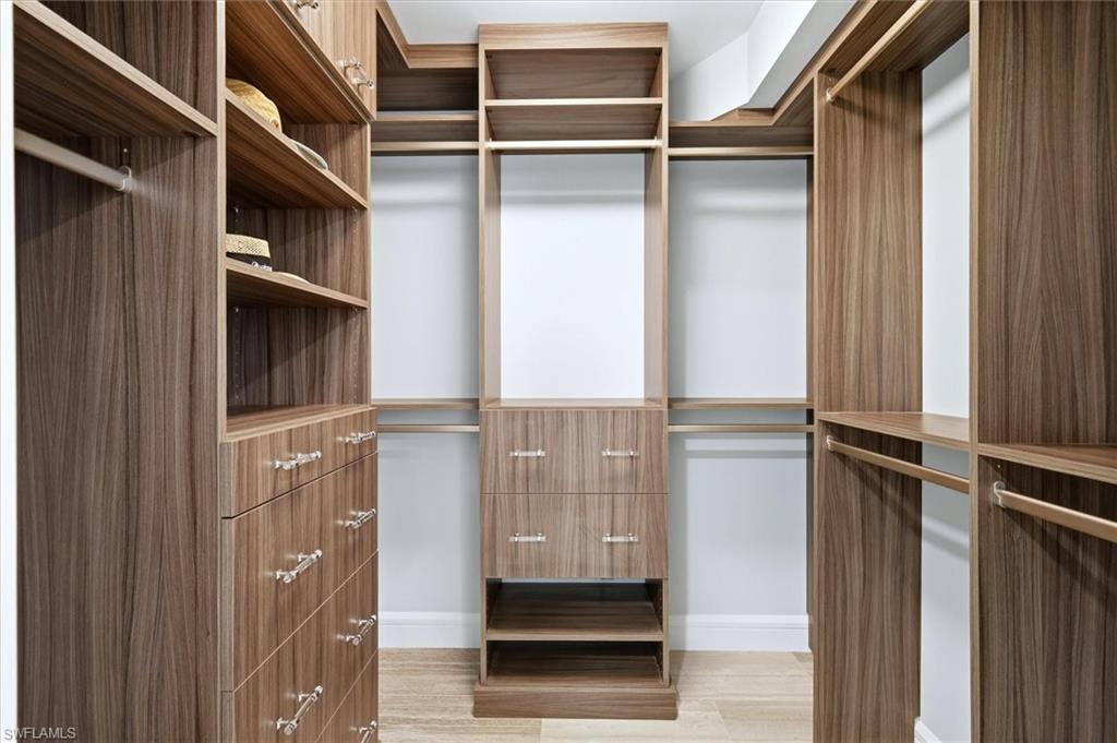 2425 Gulf Of Mexico Drive, Unit 6D Longboat Key, FL 34228 - Photo 30 of 50 Custom shelving in the walk-in closet. Auto lights as you walk in.