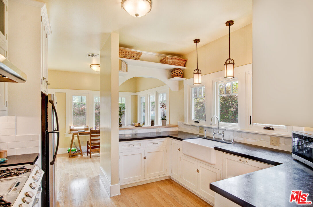 1204 Bresee Avenue Pasadena, CA 91104 - Photo 12 of 31 a large white kitchen with a large window