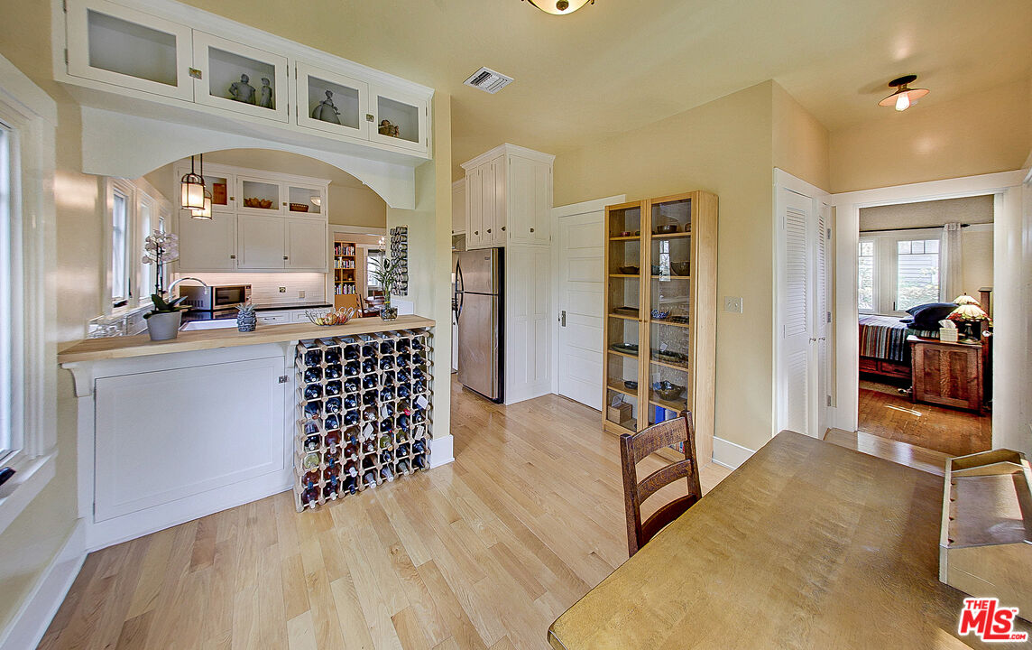 1204 Bresee Avenue Pasadena, CA 91104 - Photo 15 of 31 a living room with a bed furniture and a large mirror
