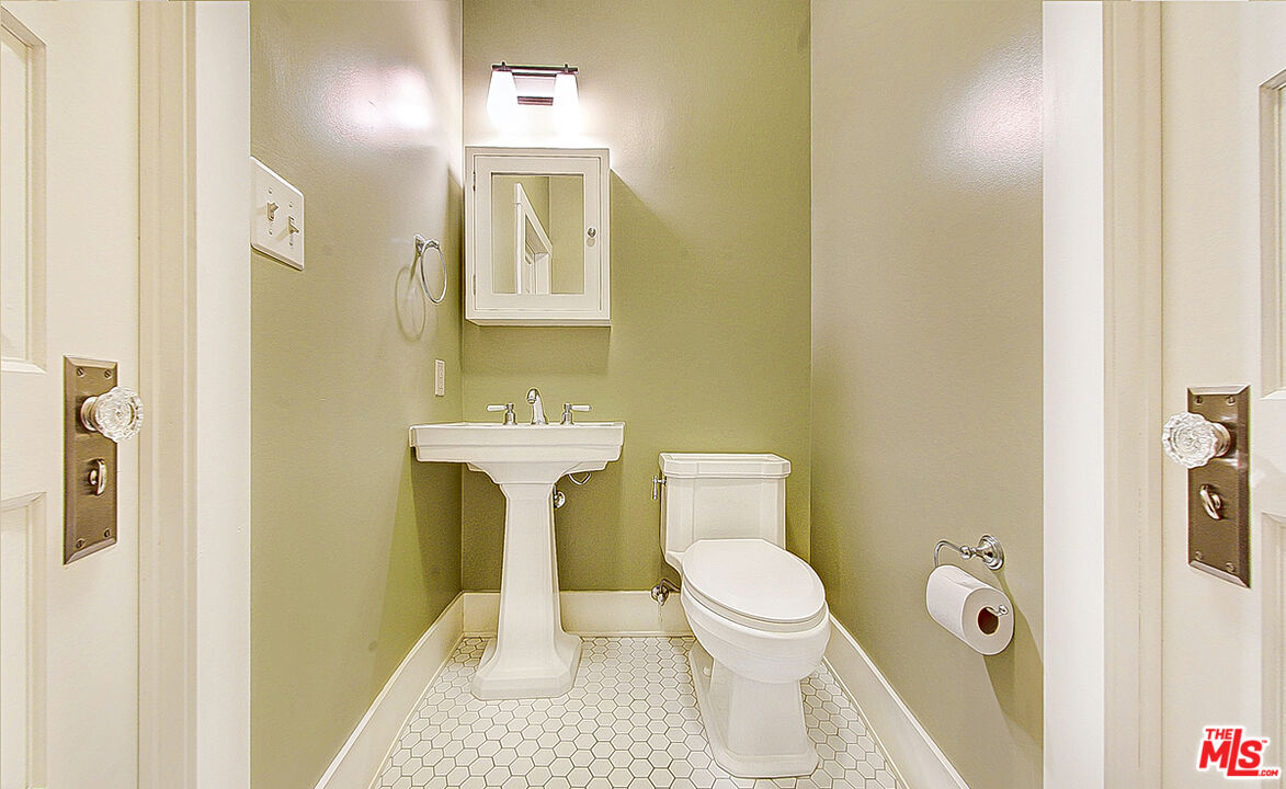 1204 Bresee Avenue Pasadena, CA 91104 - Photo 18 of 31 a bathroom with a toilet and a sink