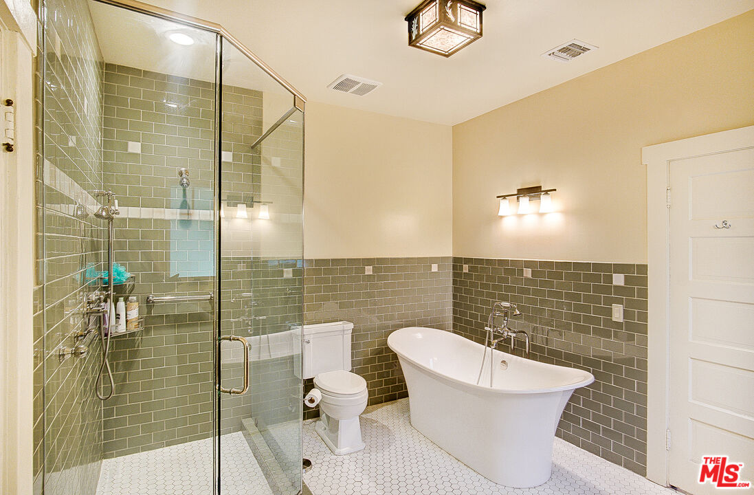 1204 Bresee Avenue Pasadena, CA 91104 - Photo 20 of 31 a bathroom with a toilet and a shower