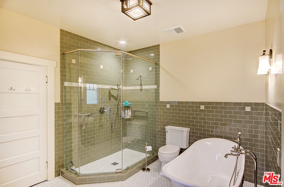 1204 Bresee Avenue Pasadena, CA 91104 - Photo 21 of 31 a bathroom with a toilet and a shower