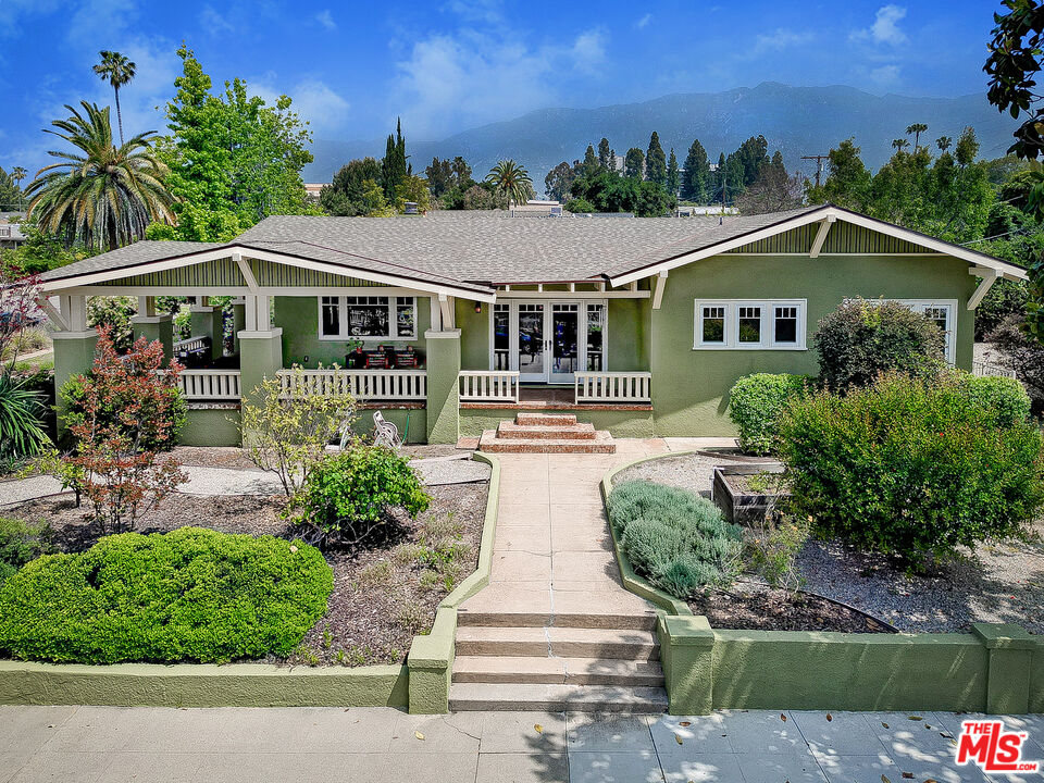 1204 Bresee Avenue Pasadena, CA 91104 - Photo 3 of 31 a front view of a house with a yard and potted plants