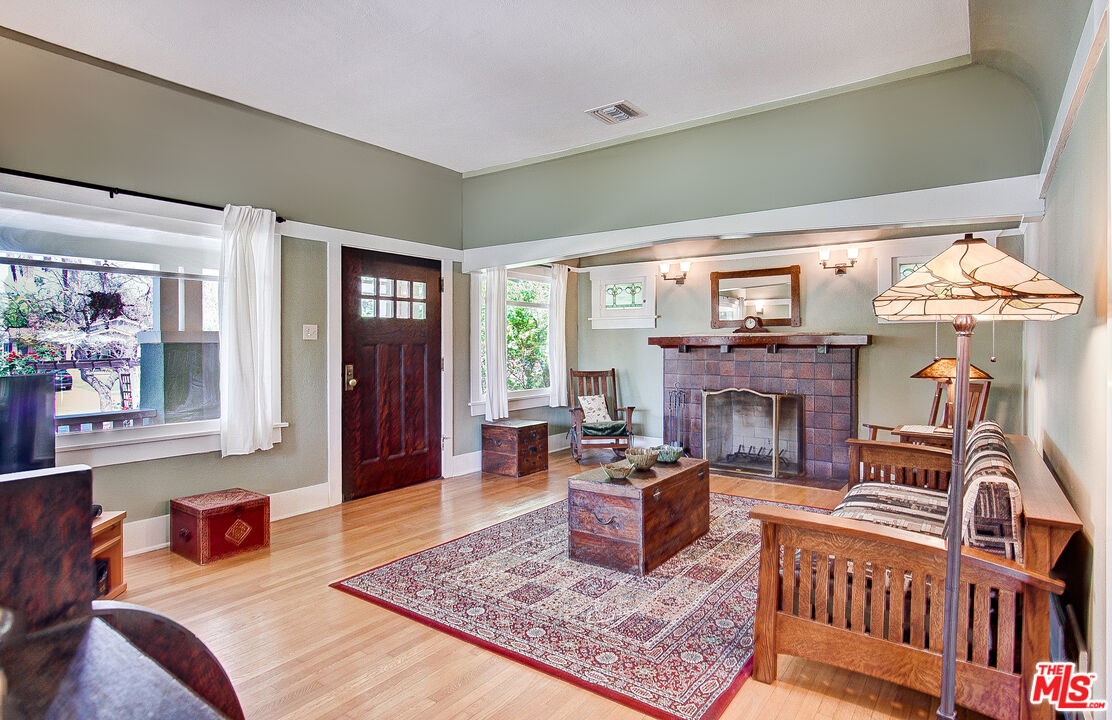 1204 Bresee Avenue Pasadena, CA 91104 - Photo 6 of 31 a living room with furniture and a fireplace