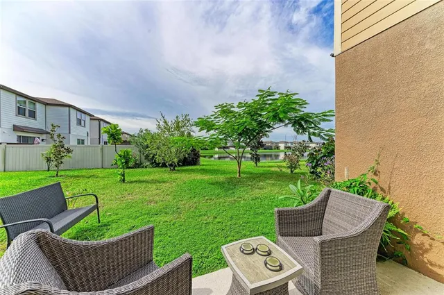 a view of a patio in backyard