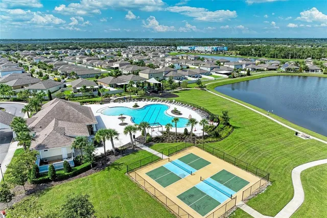 an aerial view of a house with a lake view