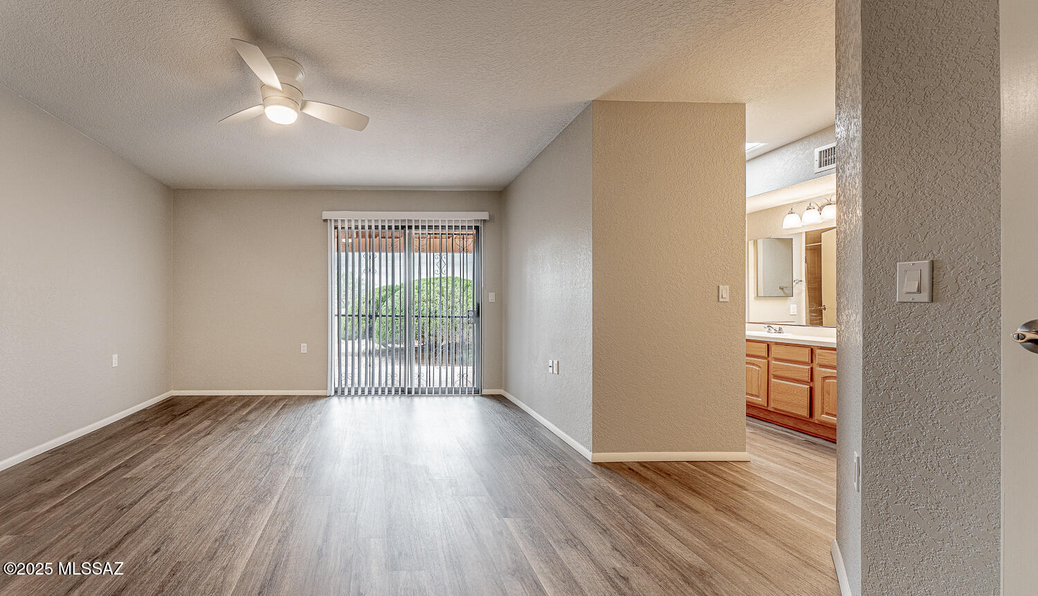 931 West Rio Guaymas Green Valley, AZ 85614 - Photo 24 of 39 an empty room with wooden floor and windows