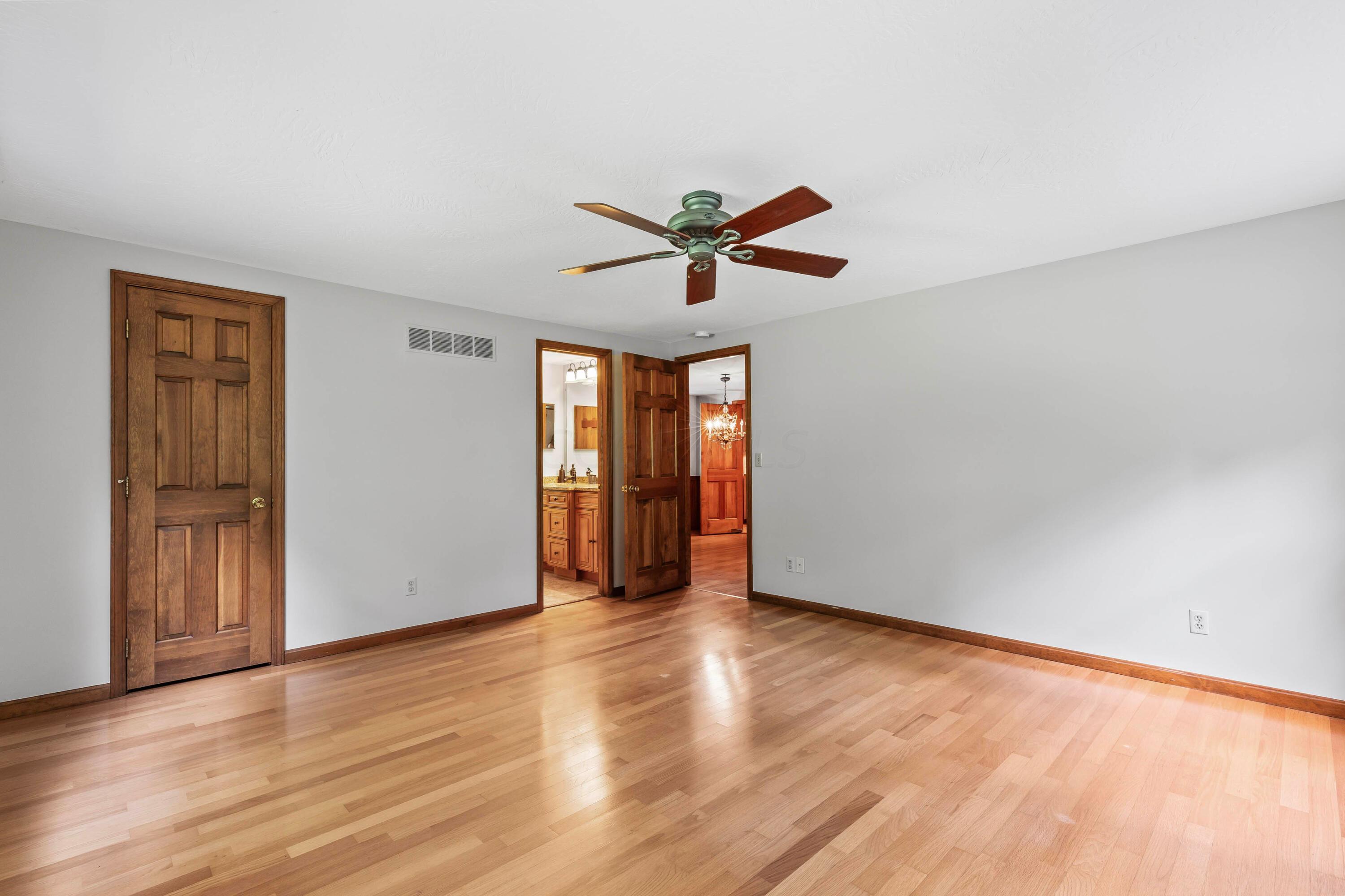 6940 Graham Road Mount Vernon, OH 43050 - Photo 7 of 70 • Hardwood flooring
• Tan painted walls
• Ceiling fan
• 2” wood blinds