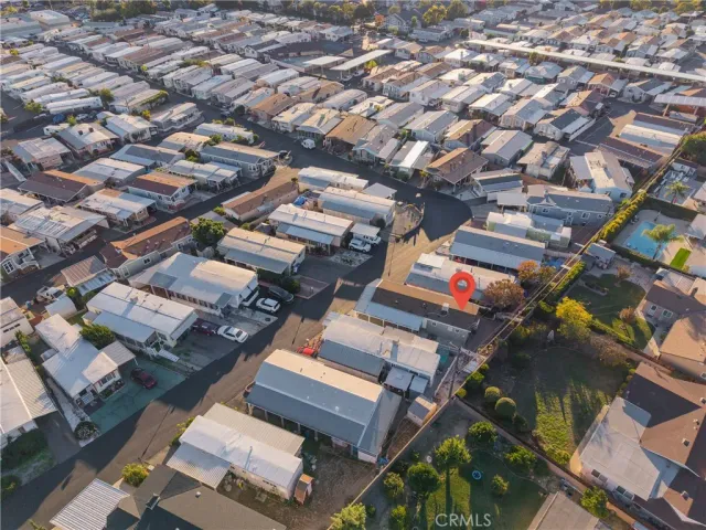 an aerial view of residential houses with city view