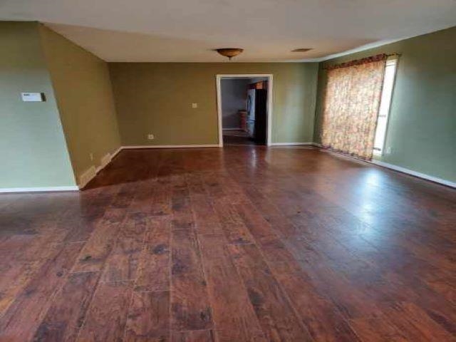3615 County Gates Road Memphis, TN 38119 - Photo 4 of 7 an empty room with wooden floor and windows