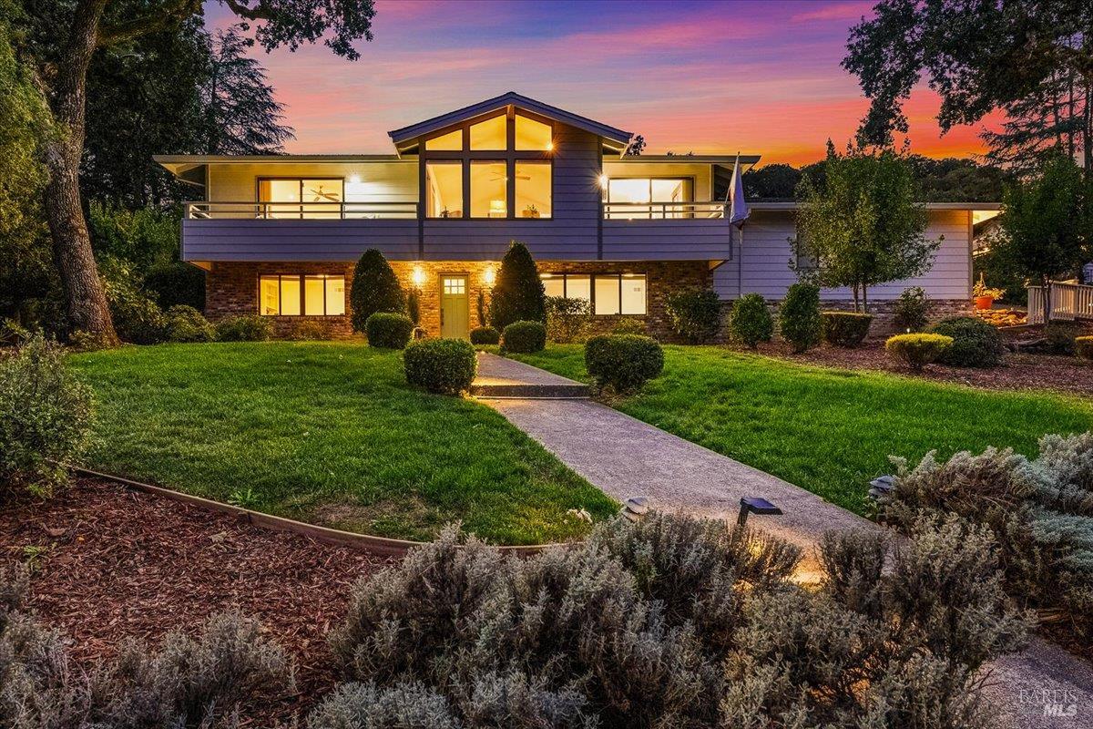 a view of a brick building next to a yard