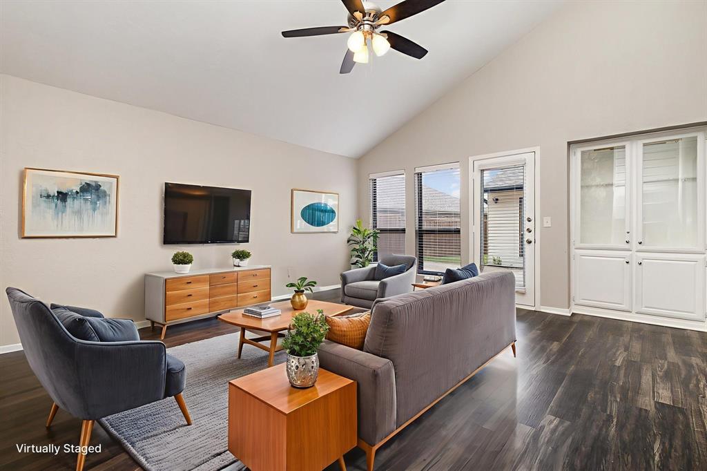 3104 Cross Bend Road Plano, TX 75023 - Photo 14 of 28 a living room with furniture and a flat screen tv