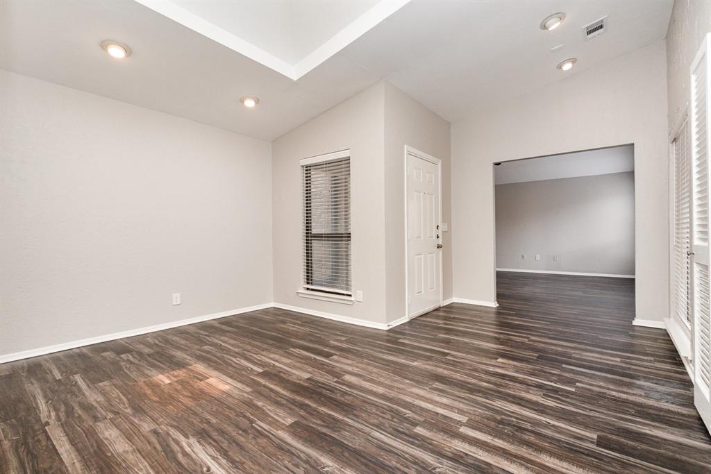 3104 Cross Bend Road Plano, TX 75023 - Photo 17 of 28 wooden floor in an empty room with wooden floor