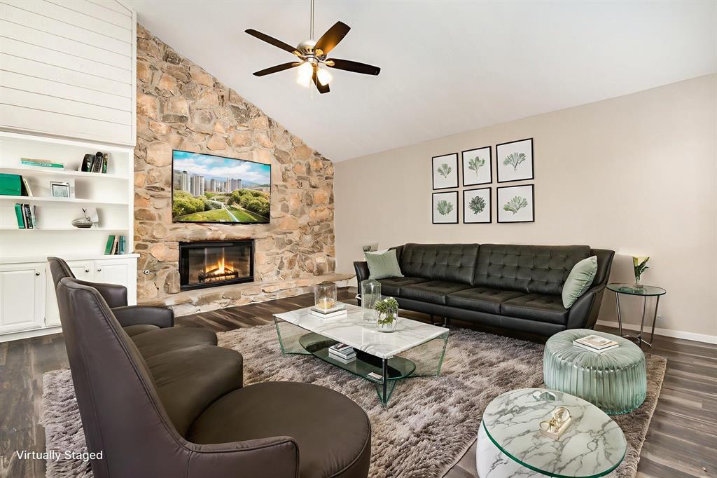 3104 Cross Bend Road Plano, TX 75023 - Photo 4 of 28 a living room with furniture and a fireplace