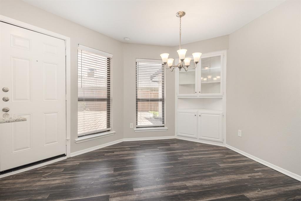 3104 Cross Bend Road Plano, TX 75023 - Photo 6 of 28 an empty room with wooden floor and windows