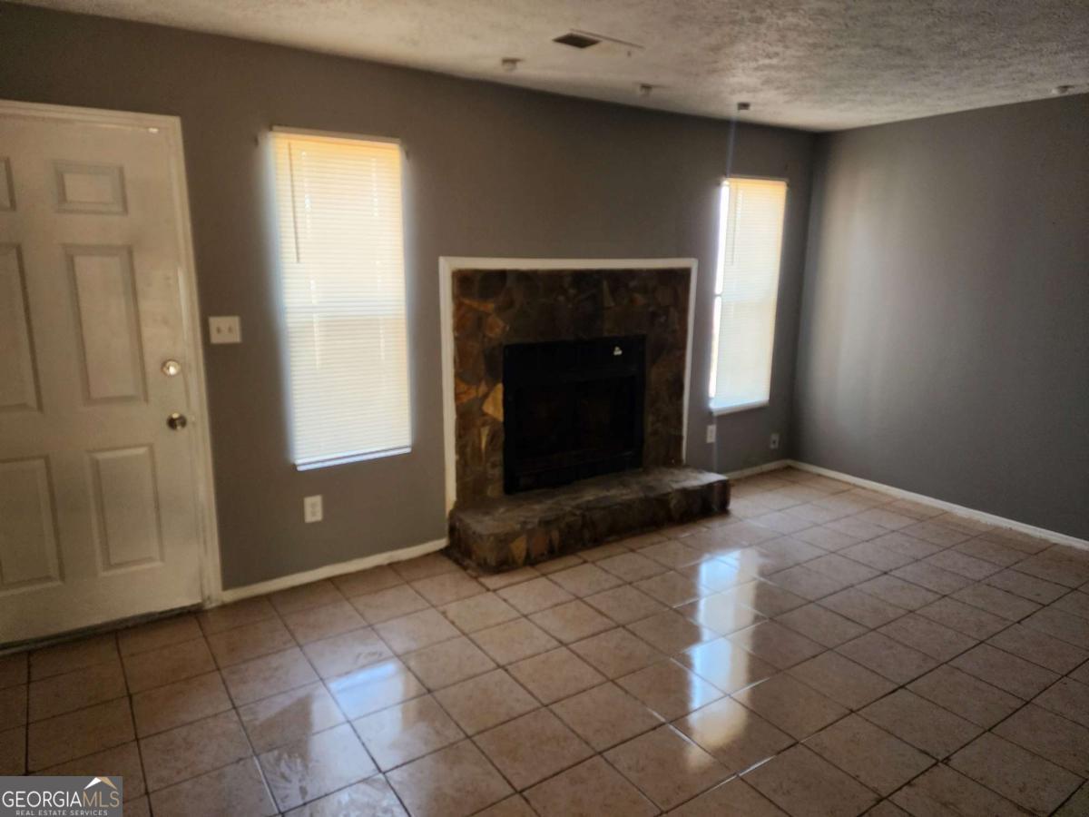 128 Cardinal Lane Jonesboro, GA 30238 - Photo 2 of 16 a view of an empty room and window