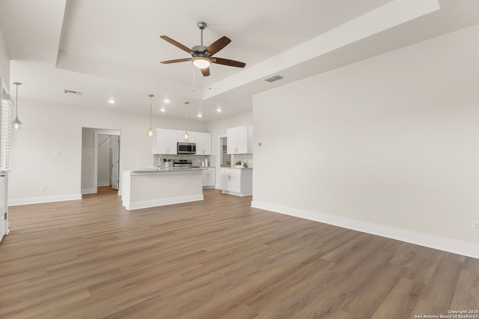 952 Rimrock Cove Spring Branch, TX 78070 - Photo 16 of 39 a view of a kitchen with a sink and wooden floor