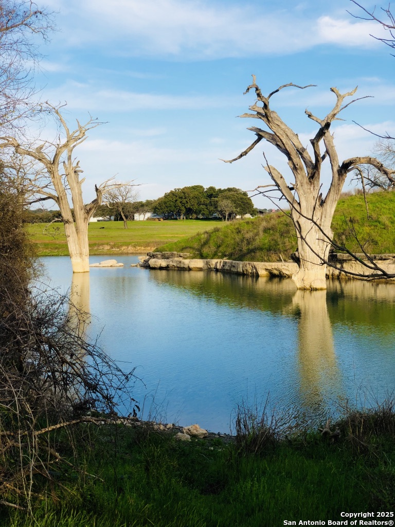 952 Rimrock Cove Spring Branch, TX 78070 - Photo 36 of 39 an aerial view of residential building with outdoor space lake view and houses with outdoor seating