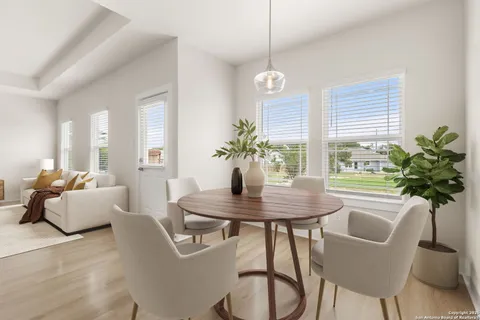 a view of a dining room with furniture window and wooden floor