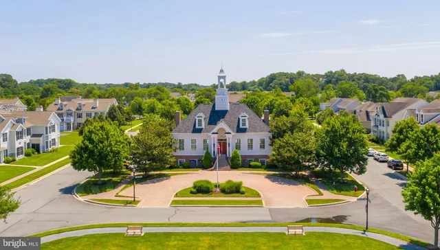 an aerial view of a residential apartment building with a yard