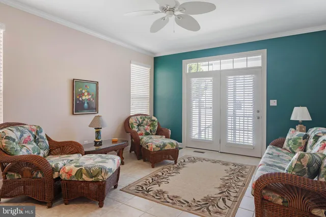 a living room with lots of furniture and a window