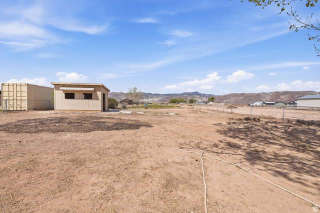 337 North Main Street Central Valley, UT 84754 - Photo 12 of 40 View of yard featuring a mountain view and an outbuilding