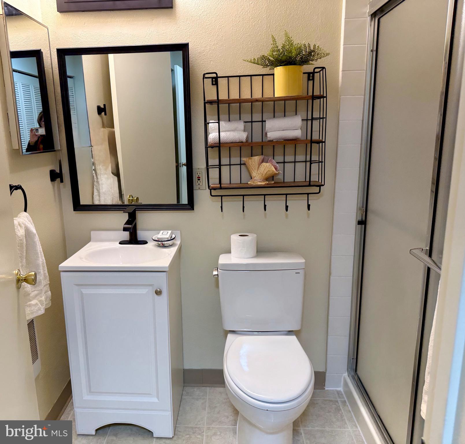 3301 South Leisure World Boulevard, Unit 991H Silver Spring, MD 20906 - Photo 5 of 27 Bathroom with walk -in shower