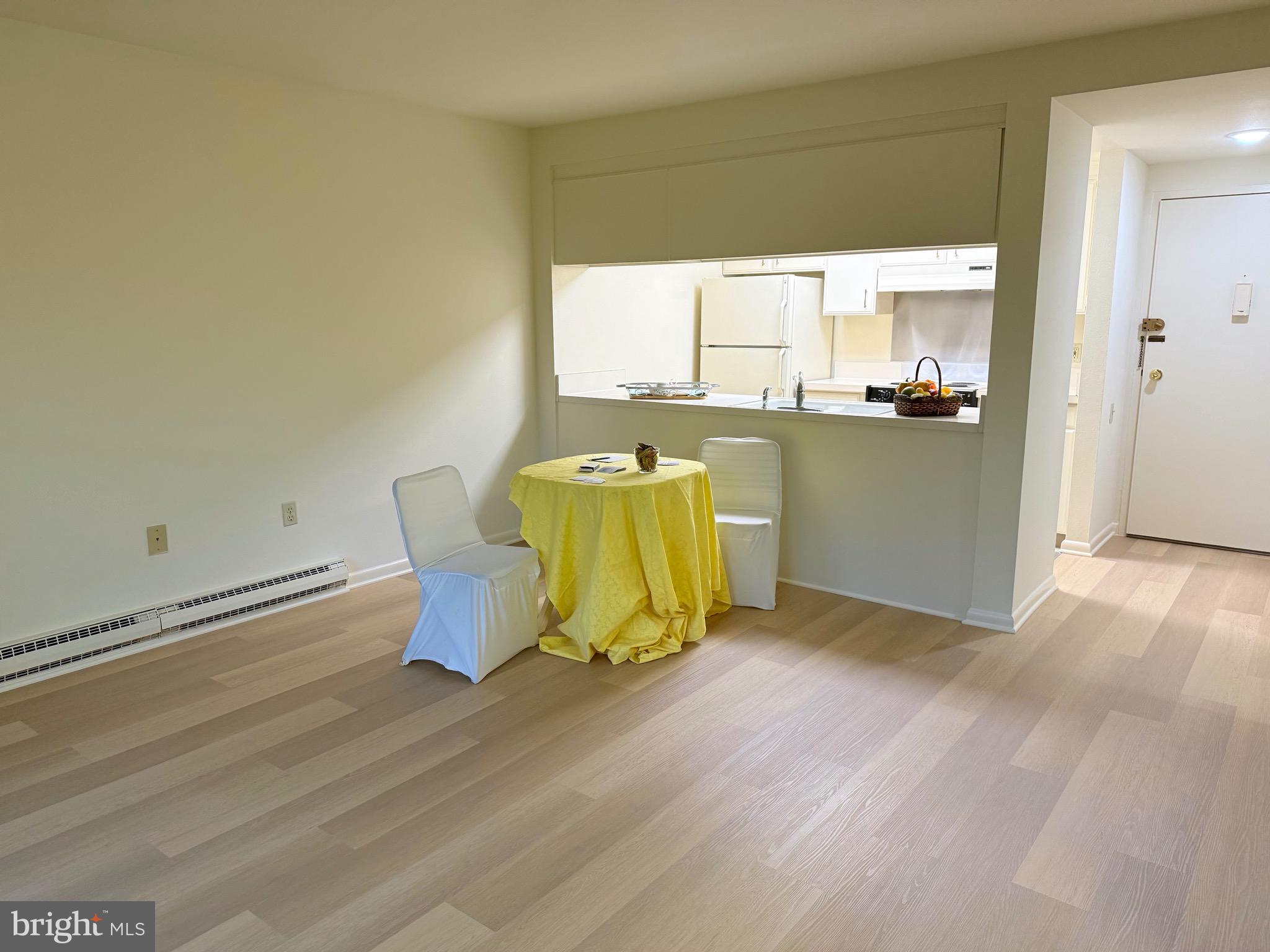 3301 South Leisure World Boulevard, Unit 991H Silver Spring, MD 20906 - Photo 8 of 27 Living room/dining area/breakfast bar