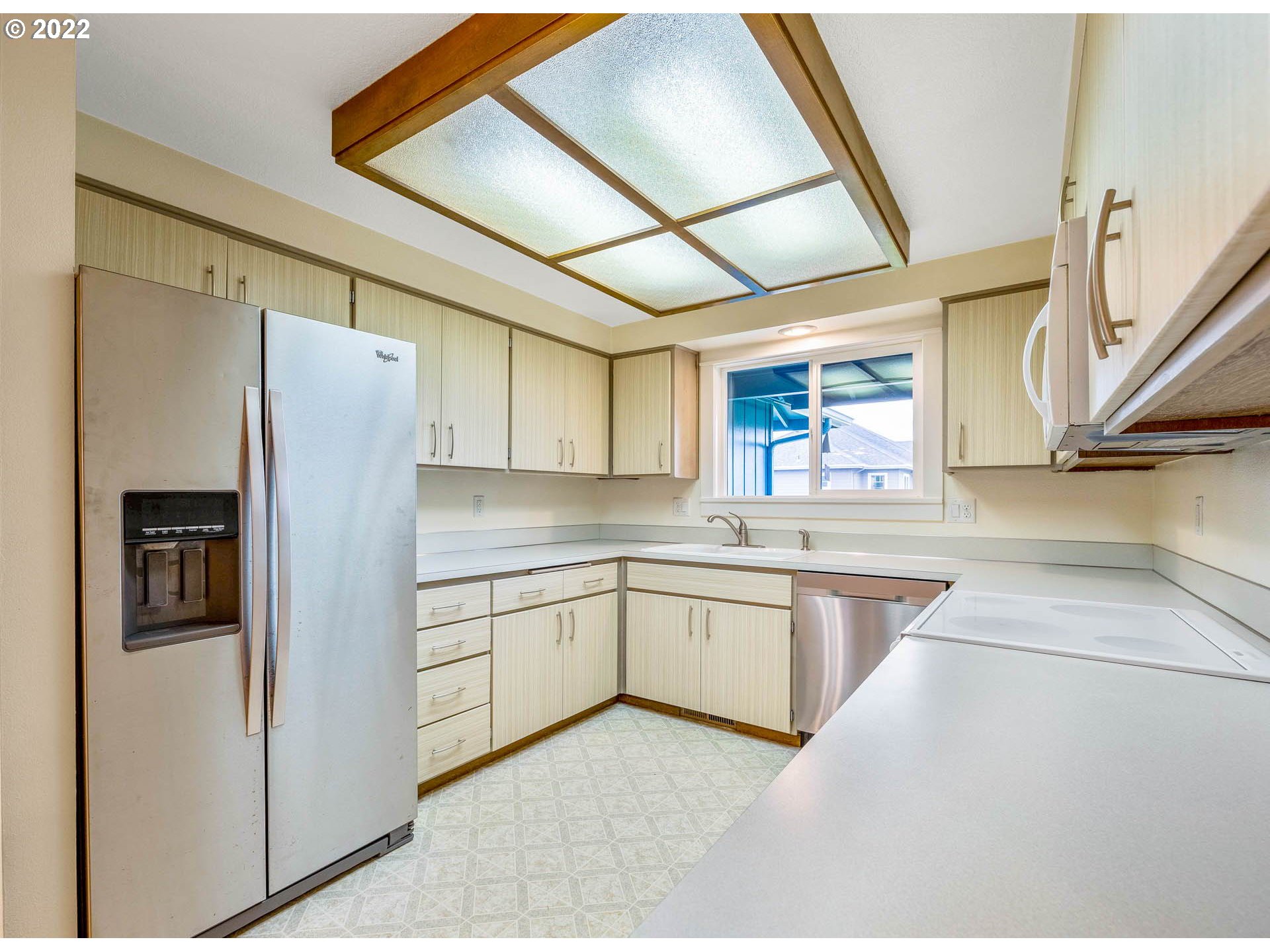 1094 Island Street Springfield, OR 97477 - Photo 9 of 31 a kitchen with stainless steel appliances granite countertop a refrigerator and a sink