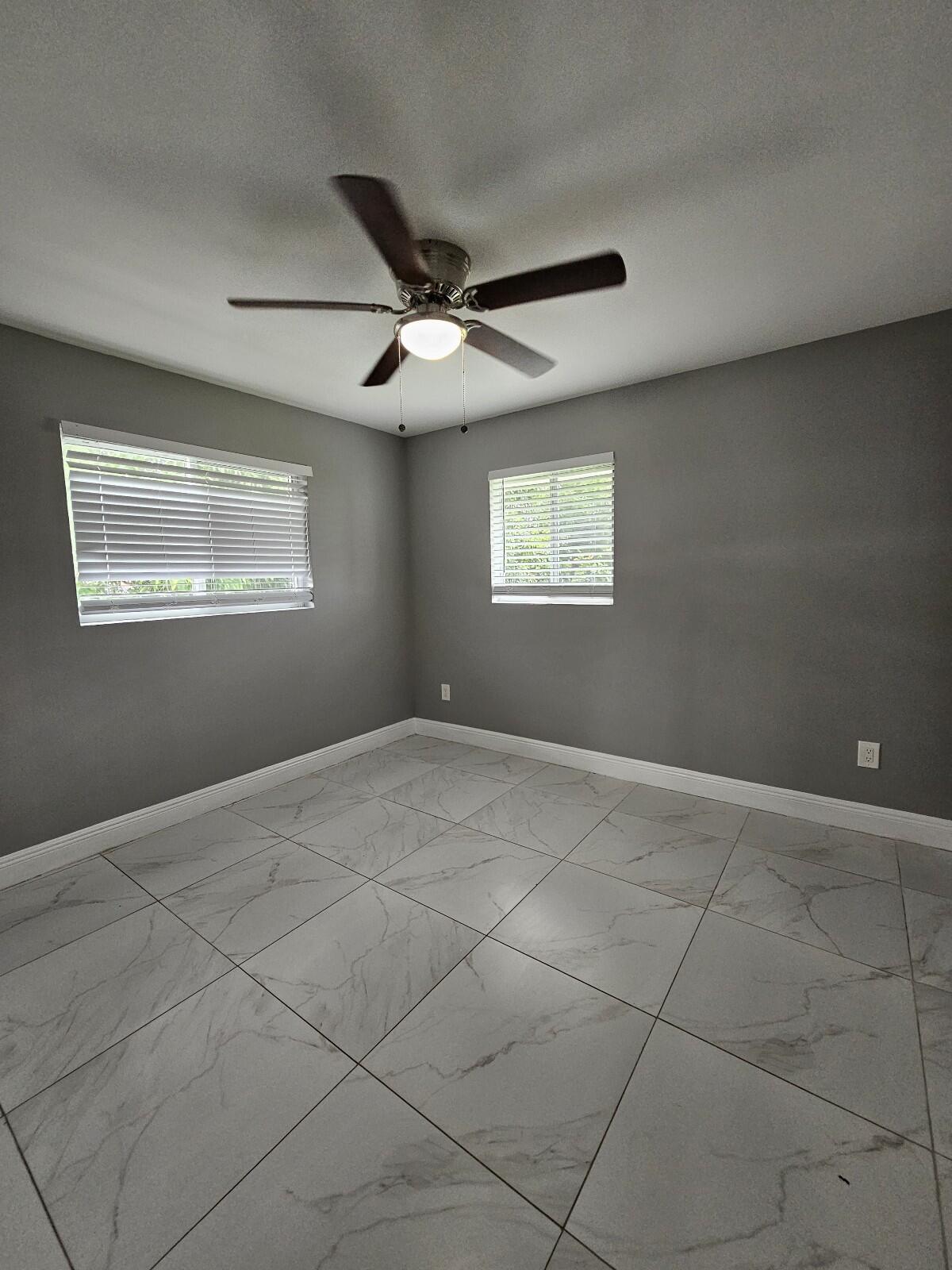 933 West 7th Street, Unit C Riviera Beach, FL 33404 - Photo 11 of 16 a view of an empty room with a window
