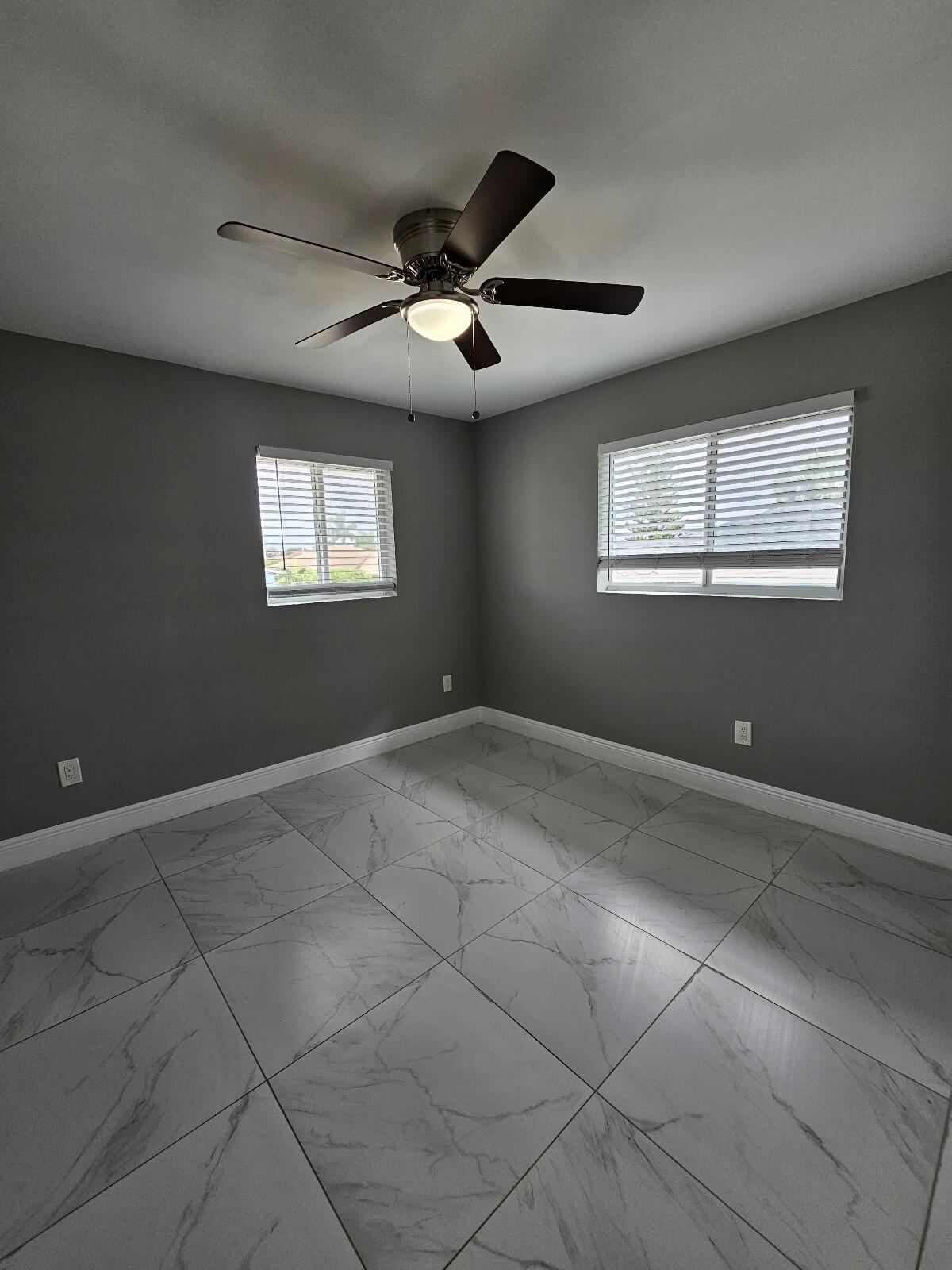 933 West 7th Street, Unit C Riviera Beach, FL 33404 - Photo 13 of 16 a view of an empty room with a window
