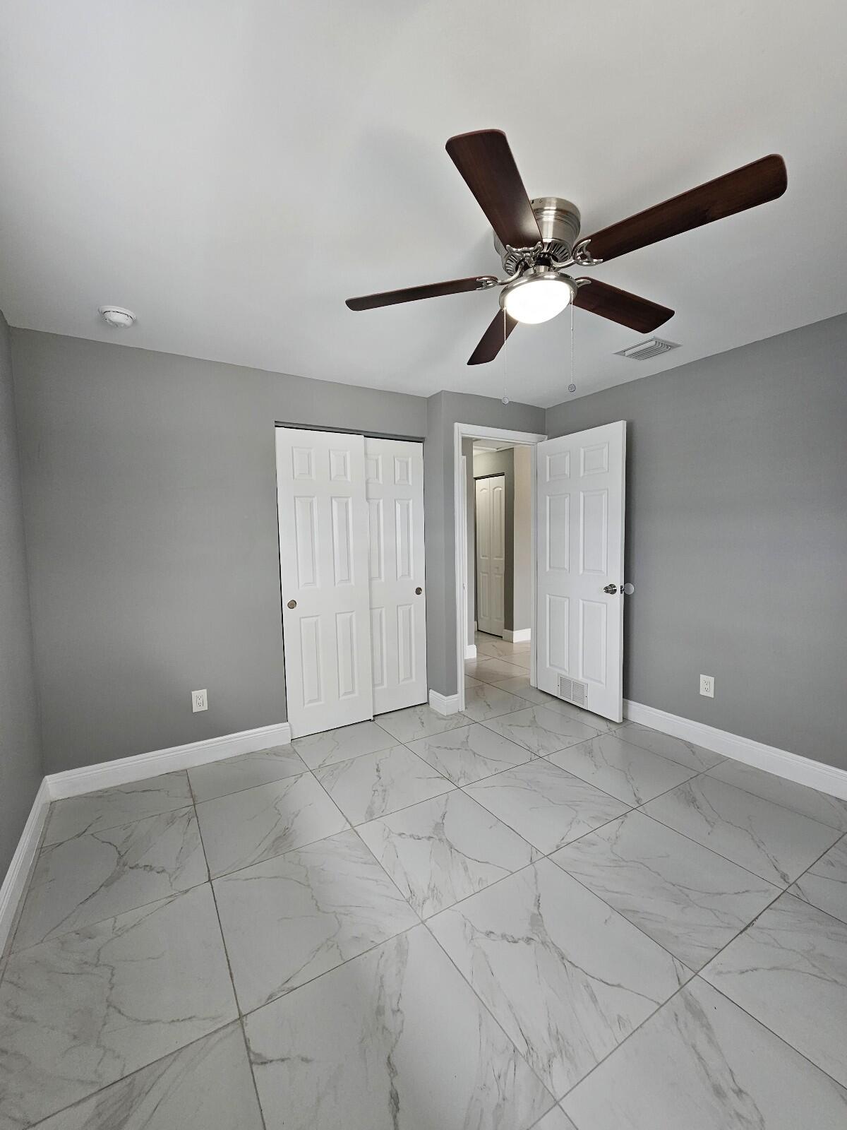 933 West 7th Street, Unit C Riviera Beach, FL 33404 - Photo 14 of 16 a view of an empty room