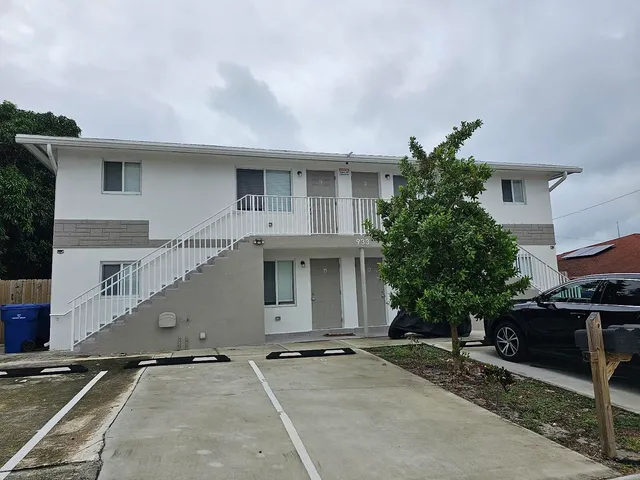 a backyard of a house with lots of green space and garden