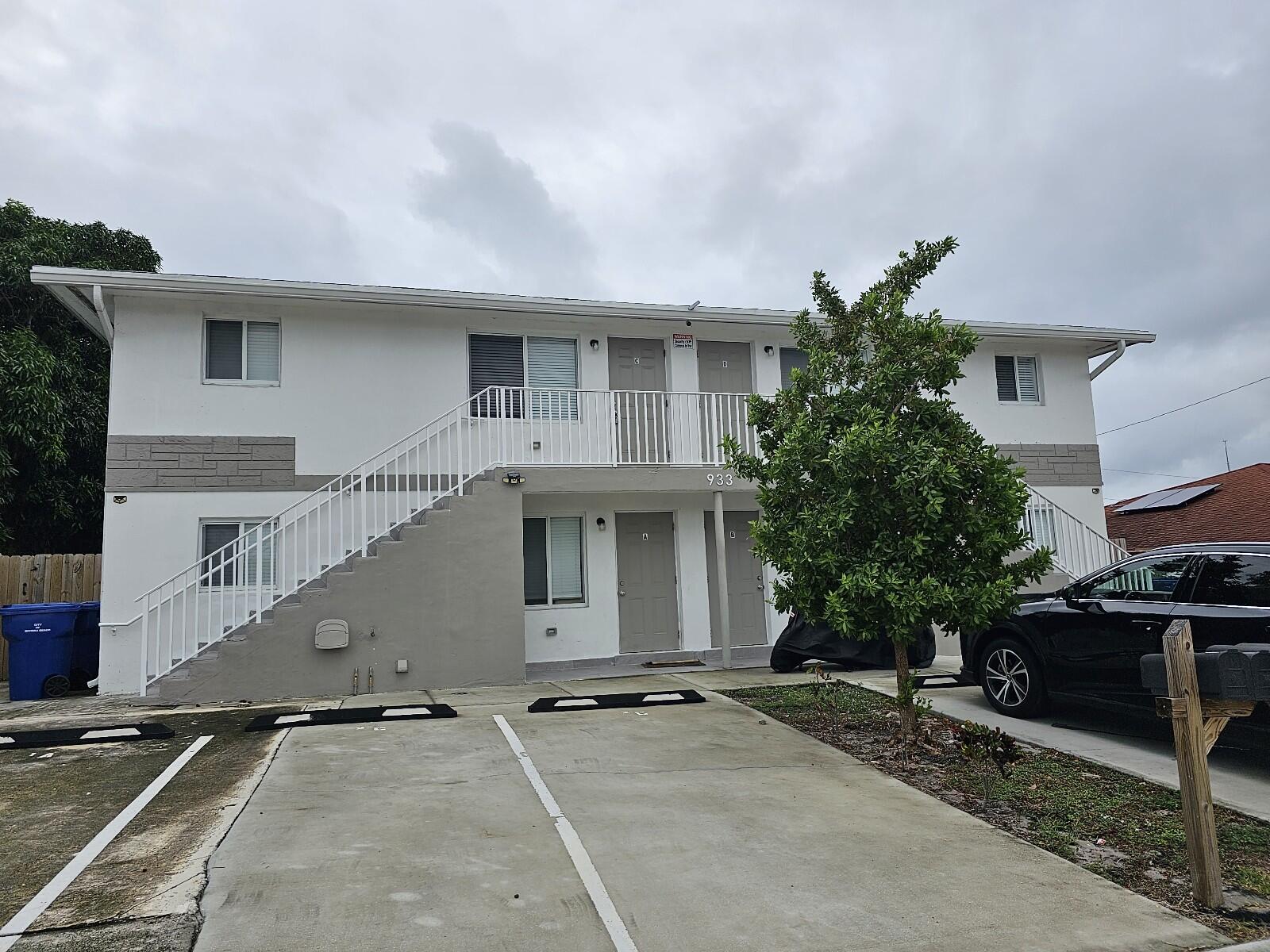 933 West 7th Street, Unit C Riviera Beach, FL 33404 - Photo 15 of 16 a front view of a house with garage